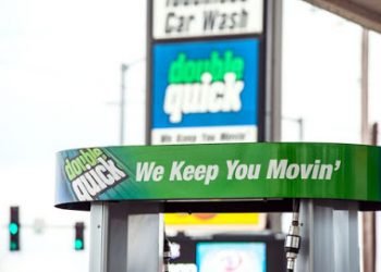 Top of gas pump that is green and reads "double quick - We keep you moving"