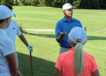 man teaching golf in the afternoon 