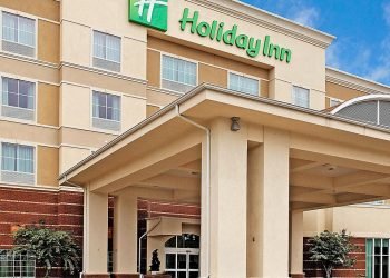 Exterior of Holiday Inn on a bright day. 