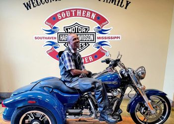 Man sitting on a motorcycle smiling at Southern Thunder Harley Davidson